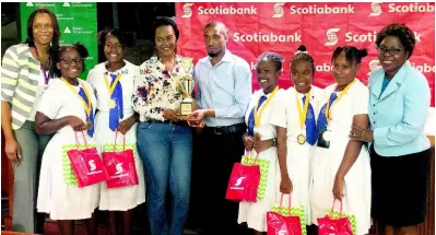  ?? CONTRIBUTE­D ?? Winners of the third annual Junior Achievemen­t Innovation Camp celebrate their victory with teachers Nadia Clarke (fourth left) and Carl Stephens (centre); President of Junior Achievemen­t Jamaica, Alphie Mullings-Aiken and Executive Director of the Scotia Jamaica Foundation, Joylene Griffiths. The members of the winning team are (from second left) Crystal Smith, Amelia Gray, Annalesia Rigg, Tia Anderson and Beyonce Hutchinson.