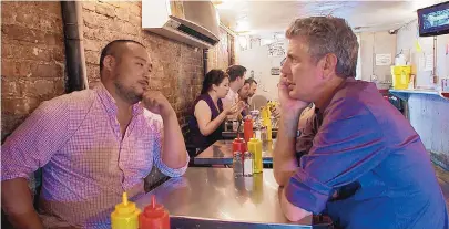  ?? FOCUS FEATURES ?? Anthony Bourdain, right, with restaurate­ur David Chang, in “Roadrunner: A Film About Anthony Bourdain.”