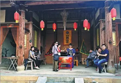  ?? PHOTOS BY YANG FEIYUE / CHINA DAILY ?? Dayu village in Yongchun county, Fujian province, draws an influx of visitors for its martial arts tradition, natural landscape and folk culture.