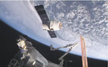  ?? NASA-TV 2015 ?? The SpaceX Dragon 6 resupply capsule nears the Internatio­nal Space Station in 2015. The capsule will be making a return trip to the space station when it is launched on a recycled rocket for NASA on Wednesday.