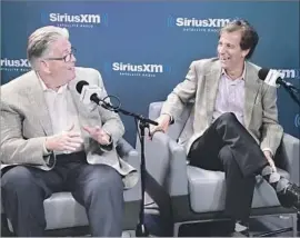  ?? Cindy Ord Getty Images ?? MIKE FRANCESA, left, and Chris Russo chat about “Mike and the Mad Dog.”