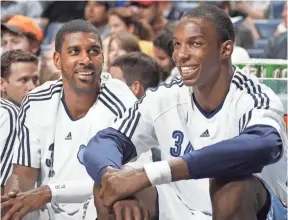  ??  ?? The Grizzlies’ O.J. Mayo and Hasheem Thabeet get a rest against the Rockets in a game in 2010. NIKKI BOERTMAN/THE COMMERCIAL APPEAL