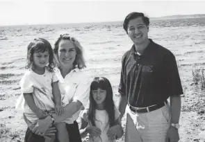  ?? COURTESY OF GEORGE HESSLER ?? George Hessler with his wife, Carol, and daughters, Nicole (being held by Carol) and Christine, on a vacation in 2002.