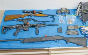  ??  ?? Multiple firearms, including a military-style rifle, were seized as part of the Operation Mystic sting conducted around the Auckland region last week.