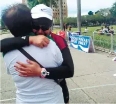  ?? (SUN.STAR FOTO/MARIAN C. BARING) ?? WELCOME COMMITTEE. Imma Joan Cubero cries after hugging her mother at the finish line of the Cebu Marathon.