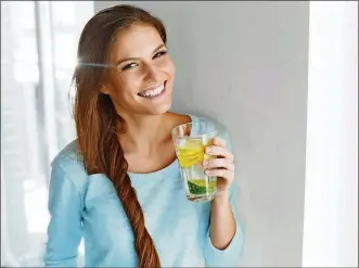  ?? DREAMSTIME ?? Drinking a glass of water first thing in the morning can help jump-start your day.