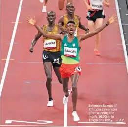  ?? — AP ?? Selemon Barega of Ethiopia celebrates after winning the men’s 10,000m in Tokyo on Friday.