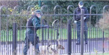  ?? PACEMAKER ?? Police near the scene of the shooting in west Belfast where a young child was present