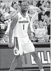  ?? AP/AL GOLDIS ?? Michigan State’s Joshua Langford celebrates his three-pointer in overtime during the Spartans’ 76-72 victory over Rutgers on Wednesday night in East Lansing, Mich.