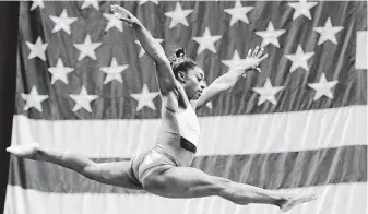  ?? Charlie Riedel / Associated Press ?? Simone Biles will attempt to become the first to dismount the balance beam with a double-twisting double somersault when she competes at the U.S. gymnastics championsh­ips on Friday night.