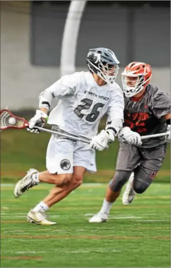  ?? ANNE NEBORAK — DIGITAL FIRST MEDIA ?? Strath Haven’s Jeffrey Conner (26) was able to shake loose from Alexander Funk and the rest of the Marple Newtown defense to rack up four goals and four assists in the Panthers’ 14-6 win.