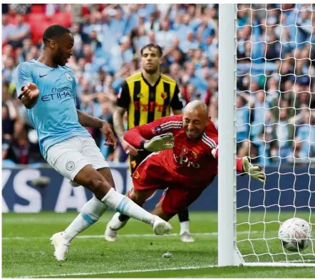 ??  ?? Easy does it: Manchester City’s Raheem Sterling (left) scoring his side’s sixth goal in the English FA Cup final against Watford at Wembley on Saturday. — Reuters