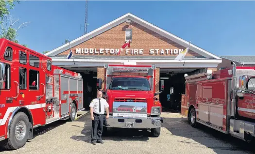  ?? CONTRIBUTE­D ?? Middleton Fire Department Chief Mike Toole, shown with some of the department’s modern equipment in front of the town’s 71-year-old fire hall, says the firefighti­ng force has outgrown the space.