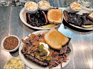  ?? VISIT WICHITA ?? Once a garage and then an antiques shop, the recently expanded B&C BBQ Pub & Grill serves platters of barbecue in the Old Town neighborho­od.