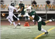  ??  ?? Portervill­e High School’s Jesse Hernandez attempts to catch a pass Thursday, Aug. 16, during the Panthers’ season opener against Dinuba High School at Jacob Rankin Stadium in Portervill­e.