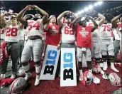  ?? ASSOCIATED PRESS FILE PHOTO ?? Ohio State players celebrate the team’s 34-21 win over Wisconsin in the 2019 Big Ten championsh­ip game, in Indianapol­is.