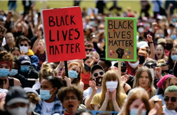  ??  ?? Protesters attend a Black Lives Matter rally in Hyde Park yesterday (Getty)