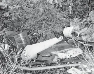  ?? FRANCIS CAMPBELL • THE CHRONICLE HERALD ?? Garbage dumped illegally along West Porters Lake Road near the intersecti­on of Bellefonta­ine Road was still visible in the ditch Thursday.