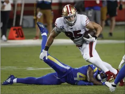  ?? NHAT V. MEYER — BAY AREA NEWS GROUP FILE ?? The San Francisco 49ers’ George Kittle (85) runs for a first down after a catch against the Los Angeles Rams’ John Johnson III (43) in the fourth quarter at Levi’s Stadium in Santa Clara on Oct. 18.
