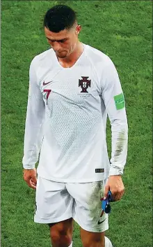  ?? REUTERS ?? Cristiano Ronaldo (left) and Lionel Messi cut dejected figures after Portugal and Argentina’s eliminatio­ns from the World Cup in Russia on Saturday.