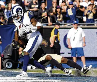  ?? MARK J. TERRILL / ASSOCIATED PRESS ?? Rams wide receiver Sammy Watkins opens the scoring with a touchdown on a 5-yard pass against Saints cornerback De’Vante Harris in Sunday’s 26-20 triumph in Los Angeles.