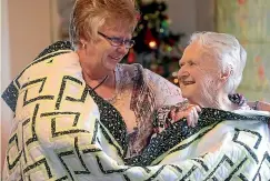  ?? SCOTT HAMMOND/ STUFF ?? Maria Bowden, left, was awarded a Kiwibank 2019 Local Hero of the Year. She made a quilt for her mother, Miriam Sullivan, right, and then 31 more for the other residents of Seaview Rest Home.