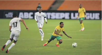  ?? /Gallo Images ?? Percy Tau will need to be on top form to disappoint an overzealou­s Ghana side that needs a win to go through to the playoffs of the 2022 Fifa World Cup qualifiers.