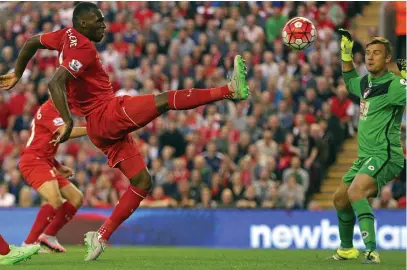  ??  ?? Full stretch: Benteke beats Boruc after Reds team-mate Coutinho had been active in an offside position