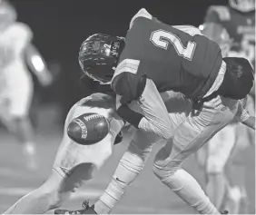  ?? MICHELLE HUTCHINS/COURIER-JOURNAL ?? KCD quarterbac­k Ethan Harris fumbles the ball during the first half of a KHSAA Class A state semifinal game against Raceland at Kentucky Country Day on Friday.