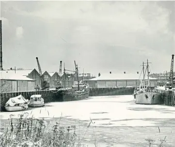  ??  ?? Above: Two small coasters tied up in Perth Lower harbour in December, 1962. Below: A train stuck in snow on the railway line near Auchterhou­se in early 1947.