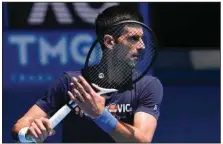  ?? (AP Photo/Mark Baker) ?? Defending men’s champion Novak Djokovic practices on Rod Laver Arena ahead of the Australian Open in Melbourne, Australia. Djokovic appealed the second cancellati­on of his visa Sunday.