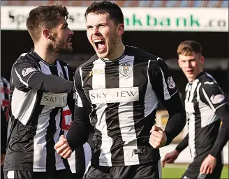  ??  ?? MAGIC MORGAN: the on-loan Celtic midfielder (centre) celebrates after putting Saints 2-1 up