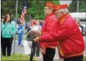  ??  ?? Members of the Marine Corps League place the battlefiel­d cross during the Oneida Memorial Day ceremony on Friday, May 26, 2017.