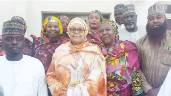  ?? PHOTO: NAN ?? New Chairman, Jere Local Council, Inna Galadima ( second left), with her supporters during the inaugurati­on of 27 council bosses by Governor Babagana Zulum, in Government House, Maiduguri… yesterday.