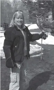  ??  ?? Wildlife Rehabilita­tor Vickie Silvia tends to a great horned owl at A Place Called Hope.