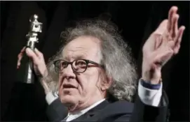  ?? MICHAEL SOHN — THE ASSOCIATED PRESS FILE ?? In this file photo, Australian actor Geoffrey Rush poses with his ‘Berlinale Camera Award.’
