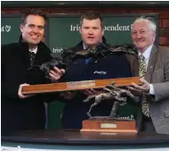  ??  ?? ABOVE: Gordon Elliott, who was named the Irish Independen­t leading trainer, receives the trophy from Geoff Lyons, Commercial Director at INM, and former trainer Martin Pipe.