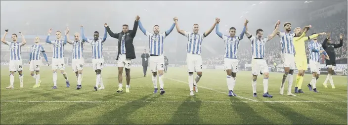  ?? PICTURE: MARTIN RICKETT/PA ?? THE WAIT IS OVER: Huddersfie­ld Town players celebrate their first home victory in almost seven months after the 1-0 Premier League over Fulham at the John Smith’s Stadium.