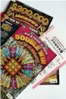  ?? (Arkansas Democrat-gazette/john Sykes Jr.) ?? Arkansas Lottery Scholarshi­p scratch off cards and Powerball ticket.