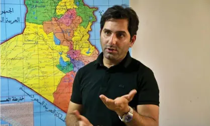  ?? Photograph: Hadi Mizban/AP ?? Raslan Haddad, the presenter of the local TV prank show, Tannab Raslan, stands in front of a map of Iraq during an interview with the Associated Press in Baghdad on Tuesday.