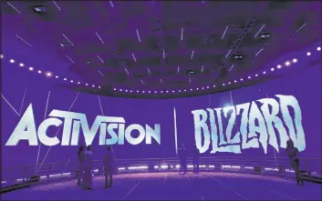  ?? Jae C. Hong The Associated Press ?? The Activision Blizzard booth during the 2013 Electronic Entertainm­ent Expo in Los Angeles. Microsoft on Tuesday announced a $68.7 billion deal to purchase Activision Blizzard, the maker of games including Candy Crush and Call of Duty.