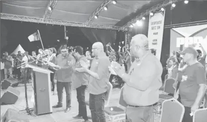  ??  ?? Members of the People’s Progressiv­e Party/Civic applaud Presidenti­al Candidate Irfaan Ali after he delivered his final campaign speech. In picture from left are Irfaan Ali (at podium), Anil Nandlall, Bharrat Jagdeo and Prime Ministeria­l Candidate Mark Phillips