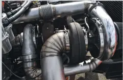  ??  ?? Kenny fabricated the turbo system himself, which positions the large 91mm/111mm/1.15 A/R atmospheri­c turbo out front. The smaller 76mm/87mm/1.10 Borgwarner is mounted on a Steed Speed manifold. Both combine to produce an efficient 80psi of boost.