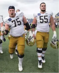 ?? AP PHOTOS ?? The Irish hope quarterbac­k Jack Coan (left), a graduate transfer from Wisconsin who’s replacing Ian Book, can click with a revamped offensive line that includes Josh Lugg (75), Jarrett Patterson (55) and Blake Fisher (below, left).