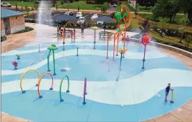  ?? JERROD THRUSH / STAFF ?? Just days before a heat wave is expected to hit the Miami Valley, a splash pad opened Wednesday in Clearcreek Twp.