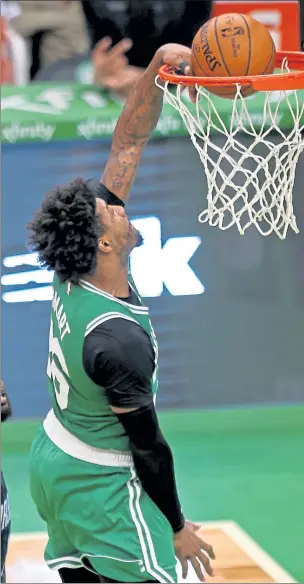  ?? STUART CAHILL / BOSTON HERALD ?? Boston’s Marcus Smart misses the easy dunk as the Celtics take on the Magic on Friday night.