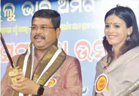  ??  ?? Union minister Dharmendra Pradhan with Upasana Mohapatra, daughter of former Congress working president Lalatendu Bidyadhar Mohapatra, who joined the BJP.