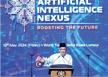  ?? — Bernama photo ?? The Prime Minister delivers his speech during the 2024 Malaysia Artificial Intelligen­ce Nexus (MY AI NEXUS) programme yesterday.