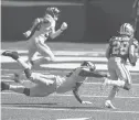  ?? BILL KOSTROUN/AP ?? 49ers running back Jerick McKinnon (28) runs past the Jets’ Neville Hewitt (46) for a touchdown during the second half Sunday in East Rutherford, N.J.