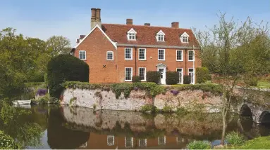  ??  ?? Earl Soham Lodge at Earl Soham has been stylishly renovated by the current owners ( below) and is approached over a twinarched bridge crossing the moat. £ 2.5m